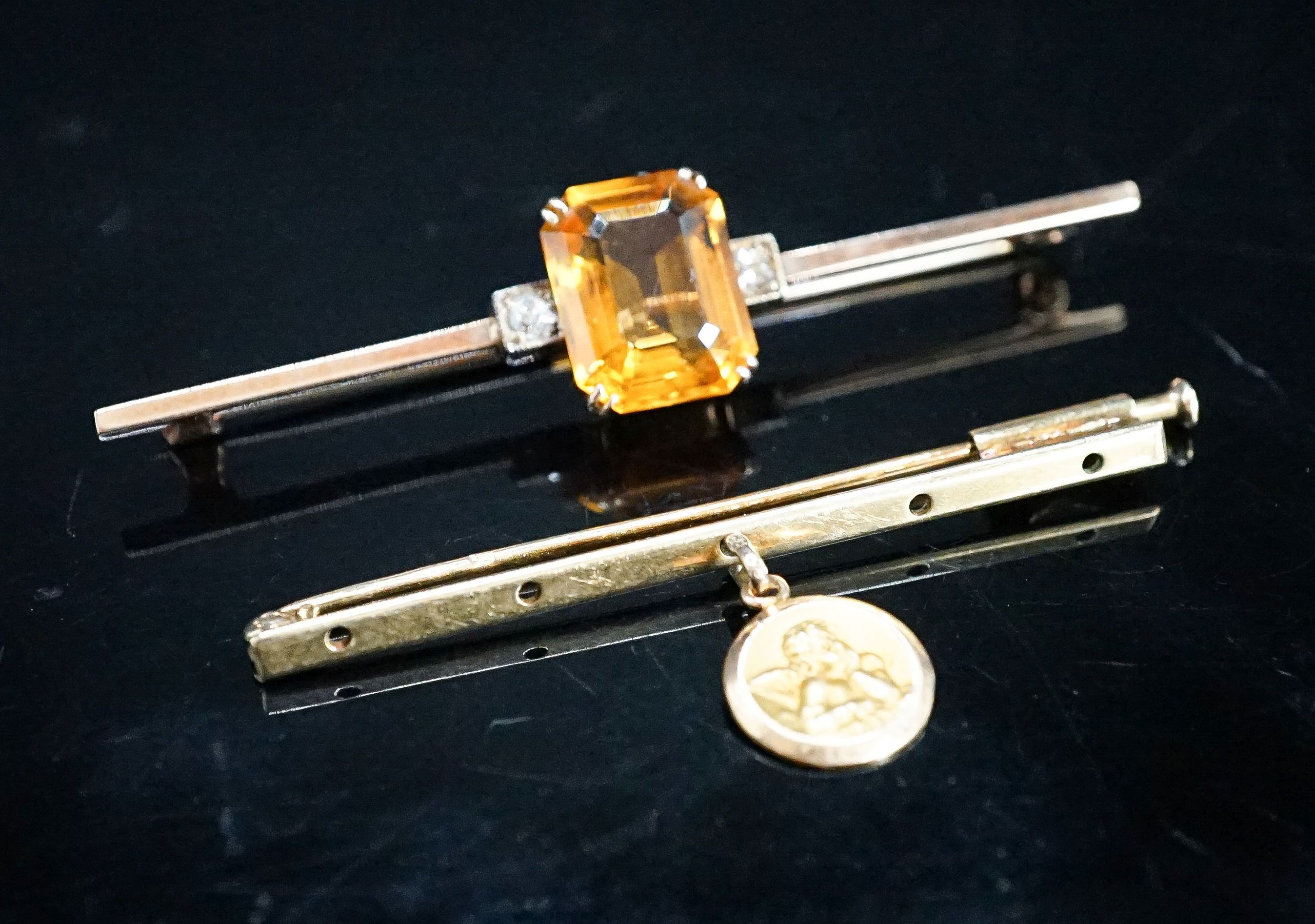 A yellow metal, single stone citrine and two stone diamond set bar brooch, 56mm and one other with cherub pendant charm, gross 6.3 grams.